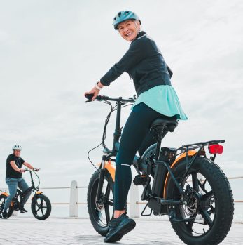 Mature woman, portrait or electrical bike helmet for future fitness, clean energy transport or sust.